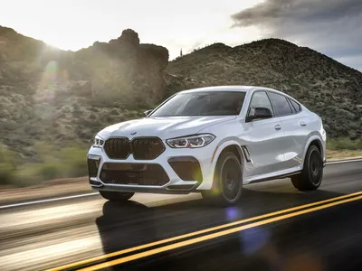 Фото BMW X6 (2014 - 2019) поколение F15 - BMW X6 2015 вид сзади фото 2