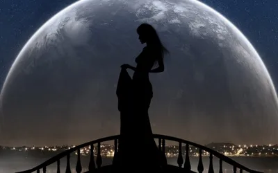 Женщина стоит перед планетой на фоне луны. | Премиум Фото