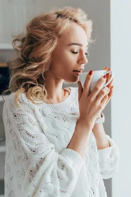 Relaxed Curly Girl Drinking Coffee With Closed Free Stock Photo and Image  244347628