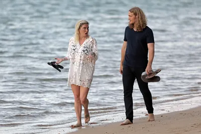 Kesha and boyfriend Brad Ashenfelter take a stroll on the beach