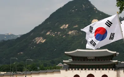 КНДР и Южная Корея договорились пройти под одним флагом на Олимпиаде — РБК