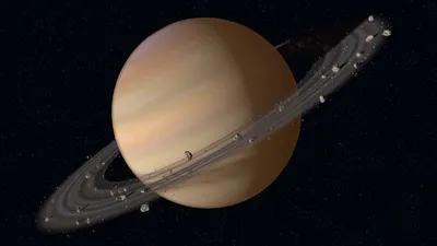 Спутник и Сатурн: снимки зонда Cassini — РБК