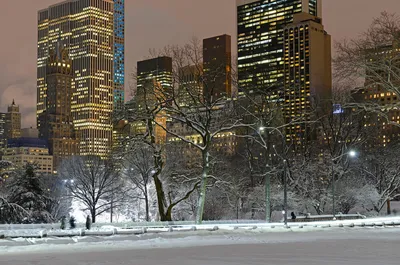 Premium Photo | City view, snowy weather, winter city streets, man in red