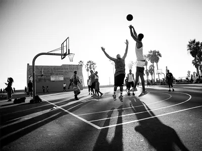 Streetball. Basketball player in action on sunset. Stock Photo | Adobe Stock