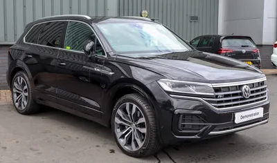 VW Touareg Facelift Rendering Tries To Peel Off Stickers From Spy Shots